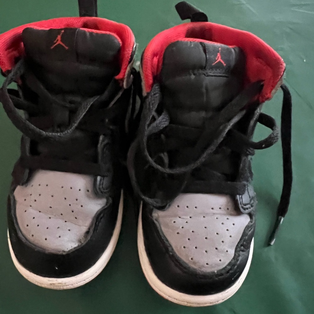 Jordan 1 Black and Red High-Top Sneakers